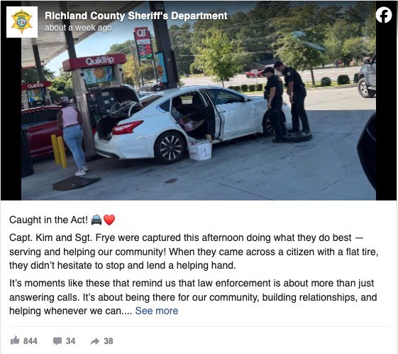 Richland County Sheriff's Department post of deputies changing a stranded driver's flat tire