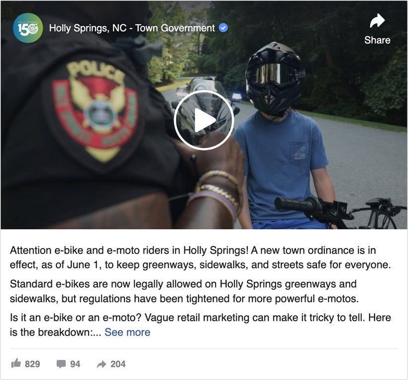 Holly Springs, North Carolina town government Facebook video post telling e-bike and e-moto riders about the new town ordinance in effect June 1, showing 829 reactions, 94 comments and 204 shares